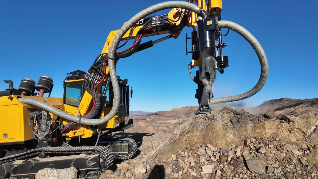 Mining & construction drilling rig working on exposed rock